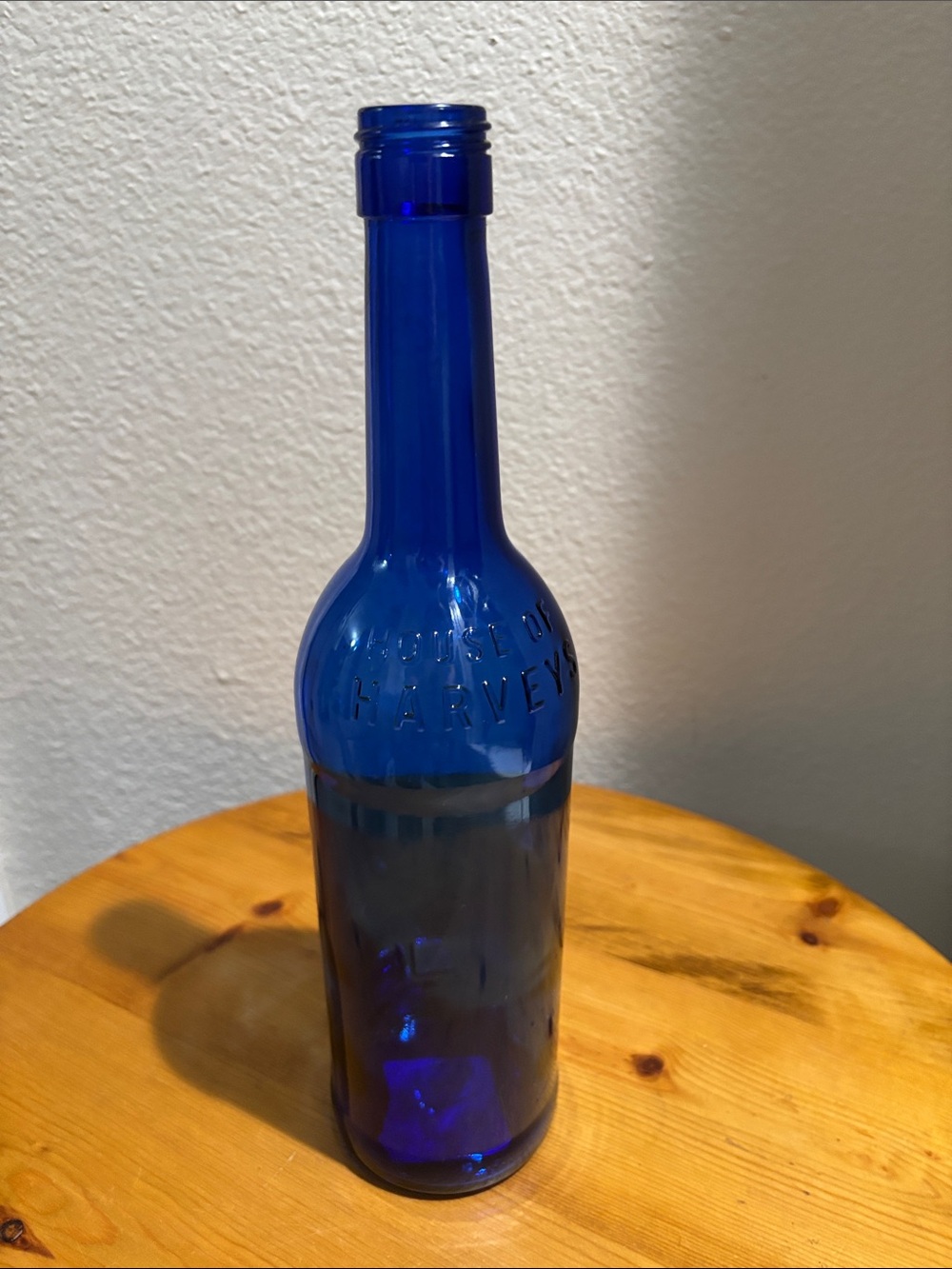 Harveys Cobalt Blue Embossed Glass Bottle